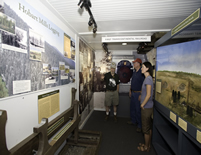 Volunteer showing logging & transcontinental exhibits